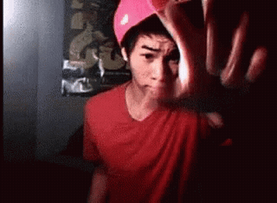 Man In Red Shirt And Pink Hat Making Funny Face GIF
