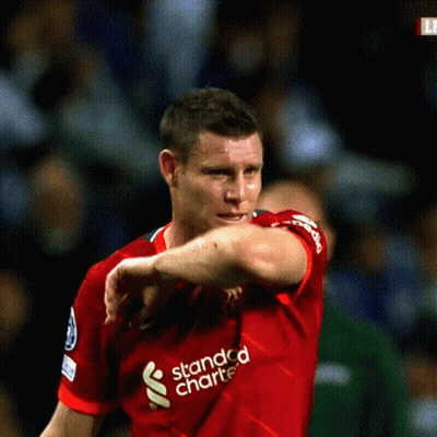 Man In Red Shirt And Shorts Removing Shirt GIF