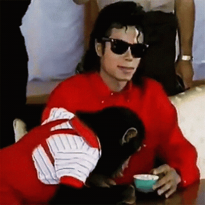 Man In Red Shirt And Sunglasses With Monkey And Coffee GIF