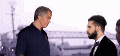 Man In Red Shirt And Tuxedo Talking GIF