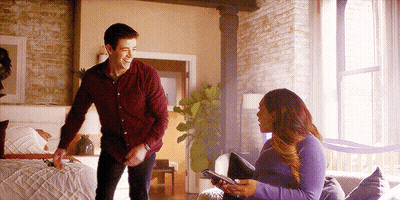 Man In Red Shirt And Woman In Purple Sweater GIF