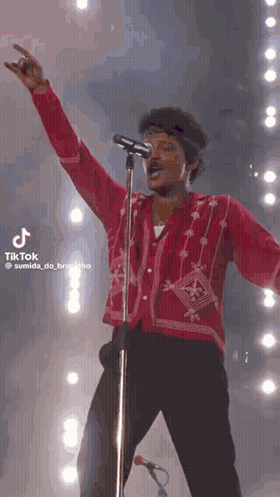 Man In Red Shirt At Microphone GIF