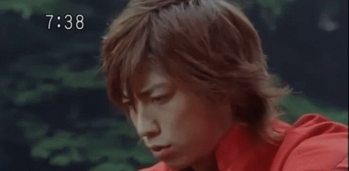 Man In Red Shirt Being Hit In Face With Hammer GIF