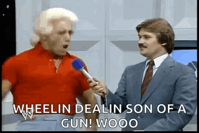 Man In Red Shirt Being Interviewed GIF