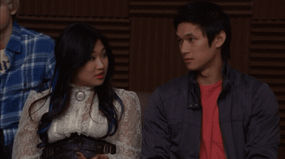 Man In Red Shirt Beside Woman In White Shirt GIF
