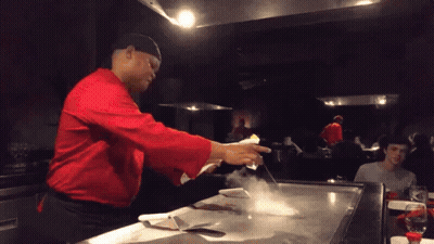 Man In Red Shirt Cooking On Stove GIF