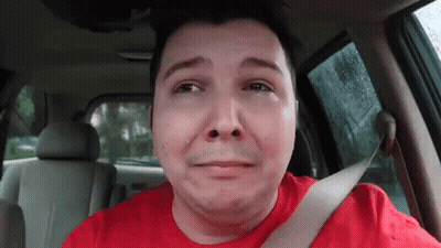 Man In Red Shirt Crying In Back Seat Of Car GIF