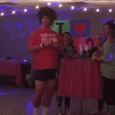 Man In Red Shirt Dancing In Room With Lights GIF