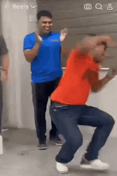 Man In Red Shirt Dancing With Others GIF