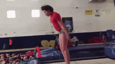 Man In Red Shirt Doing Balance Beam Trick GIF