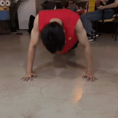 Man In Red Shirt Doing Push Ups GIF