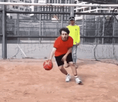 Man In Red Shirt Dribbling Basketball GIF