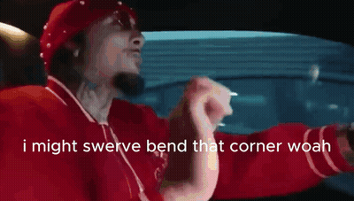 Man In Red Shirt Driving Saying I Might Swerve Bend That Corner Woah GIF