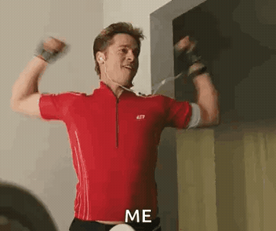 Man In Red Shirt Flexing Muscles GIF