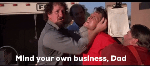 Man In Red Shirt Held By Group Saying Mind Your Own Business Dad GIF