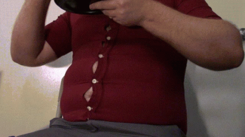 Man In Red Shirt Holding Black Bowl GIF