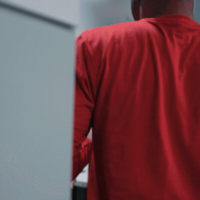 Man In Red Shirt Holding Bottle GIF