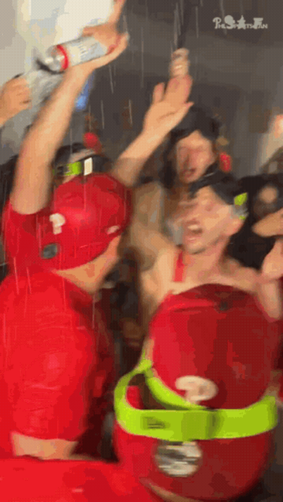 Man In Red Shirt Holding Bottle GIF