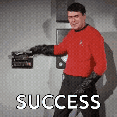 Man In Red Shirt Holding Box Saying Success GIF
