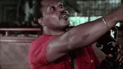 Man In Red Shirt Holding Camera Over Head GIF