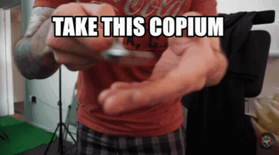 Man In Red Shirt Holding Coin Take This Copium GIF