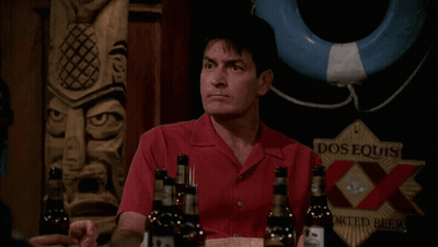 Man In Red Shirt Holding Dos Equis GIF