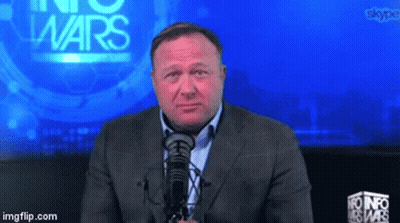 Man In Red Shirt Holding Gun Near Wheelchair GIF