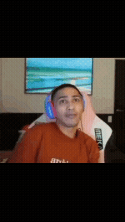 Man In Red Shirt Holding Head In Front Of TV GIF