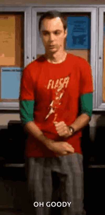 Man In Red Shirt Holding Lightning Bolt At Bulletin Board GIF
