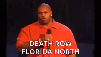 Man in Red Shirt Holding Microphone Talking About Death Row Florida North