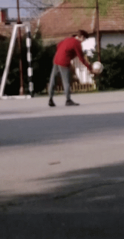 Man In Red Shirt Holding Soccer Ball GIF