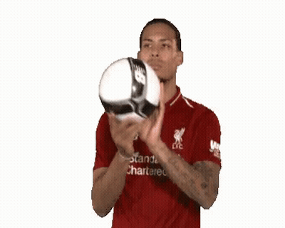 Man In Red Shirt Holding Soccer Ball GIF