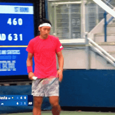 Man In Red Shirt Holding Tennis Racket In Front Of Scoreboard Saying 460 AD 631 GIF