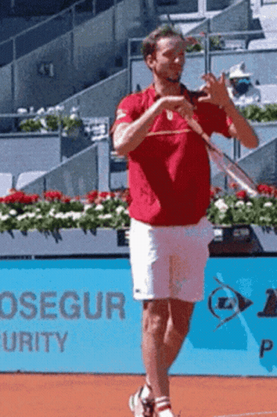 Man In Red Shirt Holding Tennis Racquet GIF