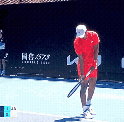 Man In Red Shirt Holding Tennis Racquet GIF