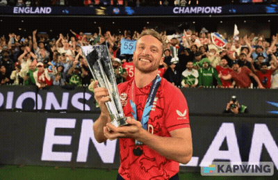 Man In Red Shirt Holding Trophy GIF