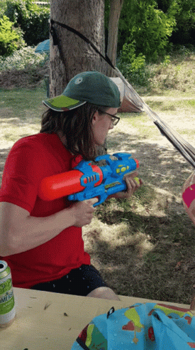 Man In Red Shirt Holding Water Gun Summer GIF