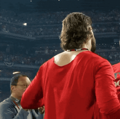 Man In Red Shirt Hugging Man In Red Hat GIF