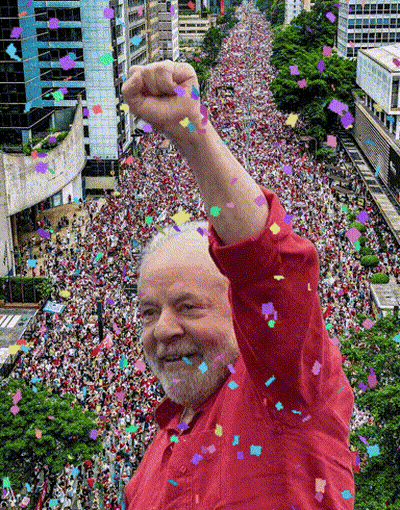 Man In Red Shirt In Front Of Crowd GIF