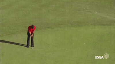 Man In Red Shirt Jumping At Golf Course GIF