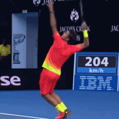 Man in Red Shirt Jumping Holding Tennis Racquet