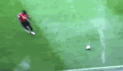Man In Red Shirt Kicking Soccer Ball GIF