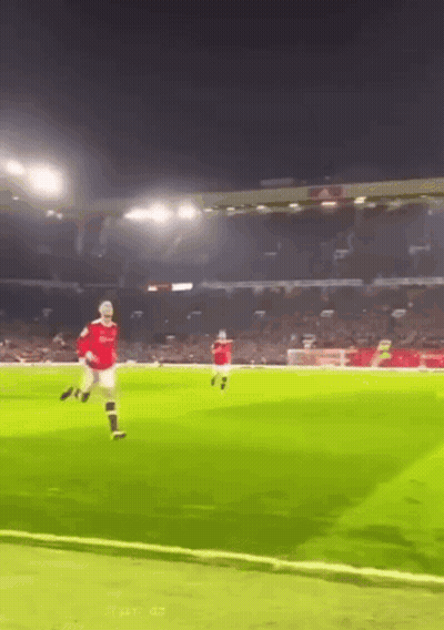 Man In Red Shirt Kicking Soccer Ball GIF