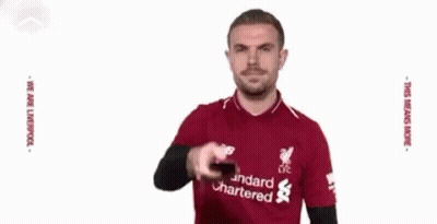 Man In Red Shirt Kicking Soccer Ball GIF
