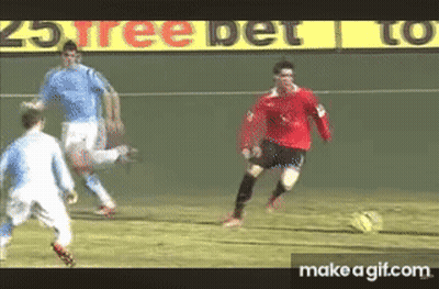 Man In Red Shirt Kicking Soccer Ball GIF