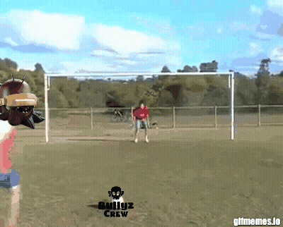 Man In Red Shirt Kicking Soccer Ball GIF