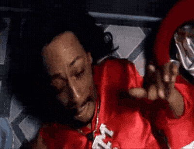 Man In Red Shirt Laying On Bed GIF