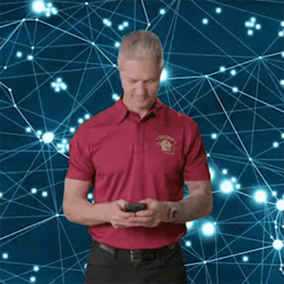 Man In Red Shirt Looking At Phone GIF
