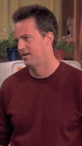 Man In Red Shirt Making Face With Eyes Closed GIF