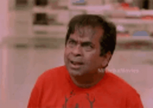 Man In Red Shirt Making Funny Face GIF